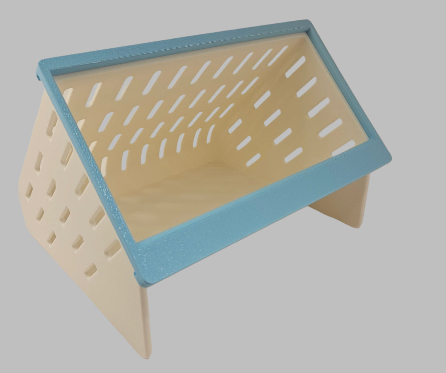 White 3D printed hay feeder with blue front with easy-fill top opening for small pets
