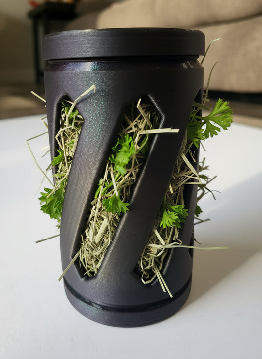 a purple and black sparkling hay roller toy for rabbits