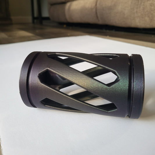 A black and purple shimmering hay roller toy for rabbits