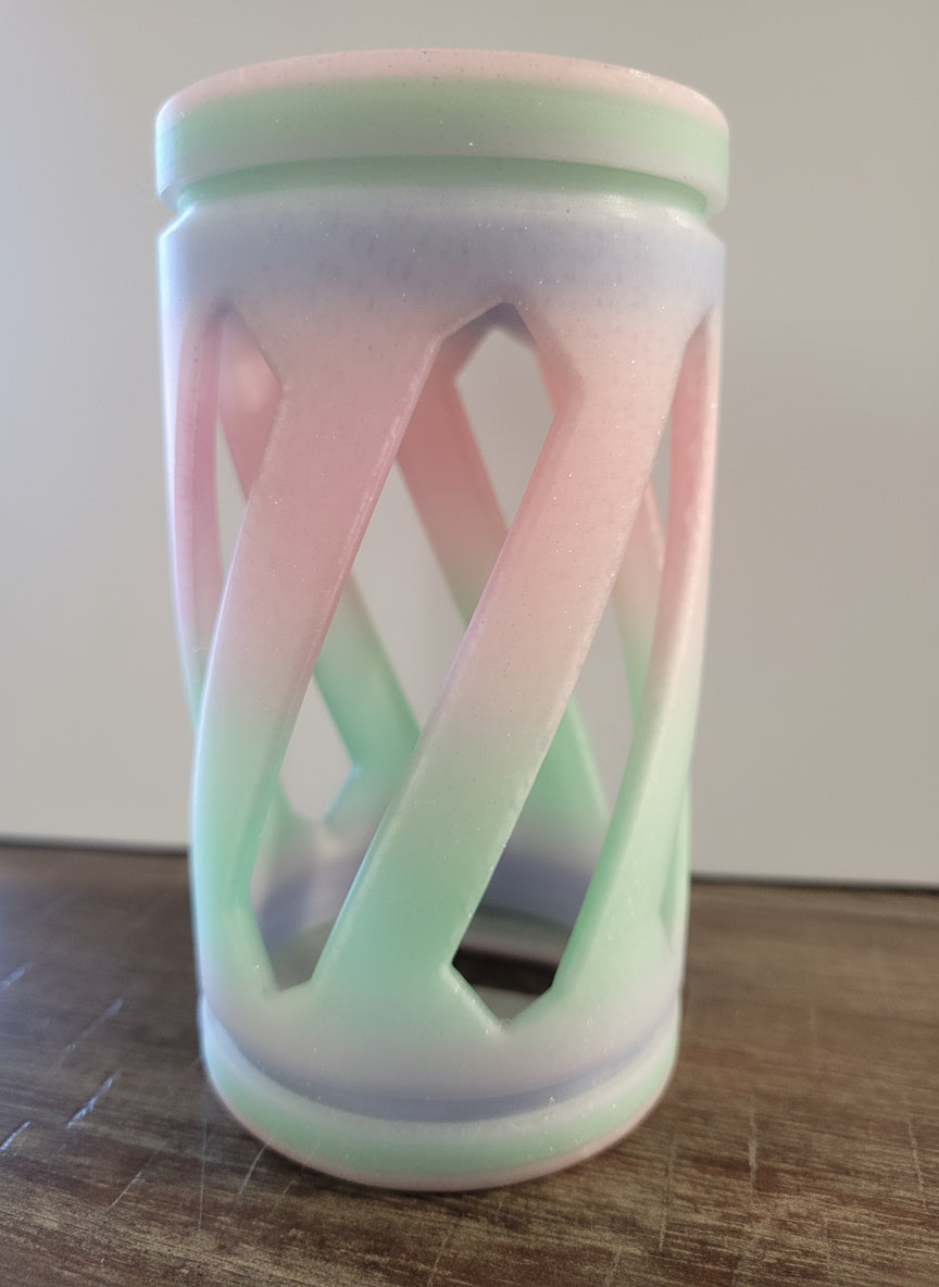 a pastel rainbow colored hay roller toy for rabbits