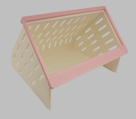 White 3D printed hay feeder with pink front with easy-fill top opening for small pets side view
