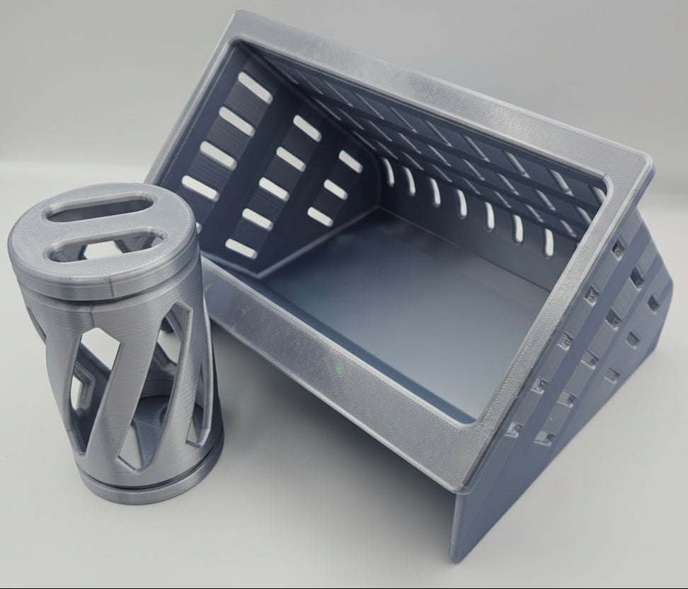 a silver hay feeder and hay roller toy for rabbits