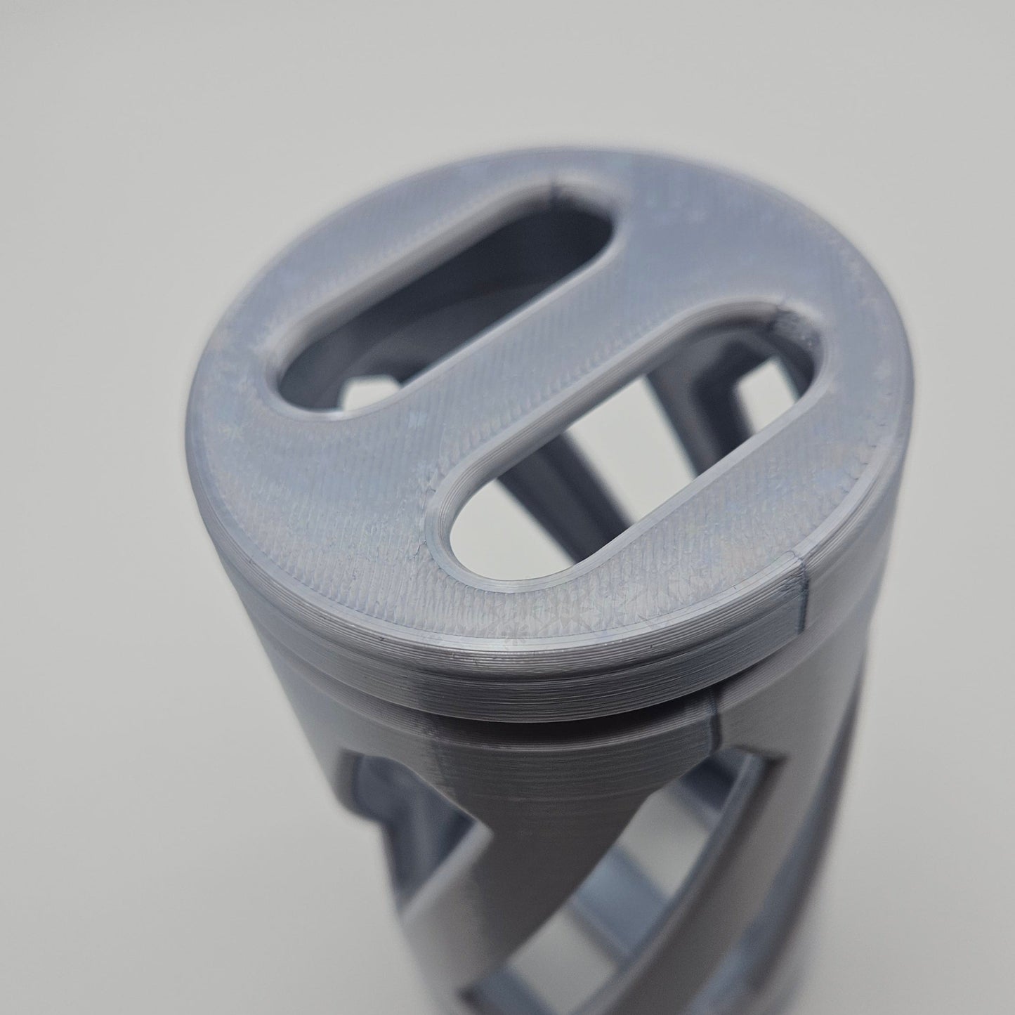 a silver hay roller toy for rabbits